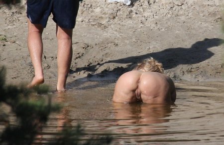 Naked on the beach spying