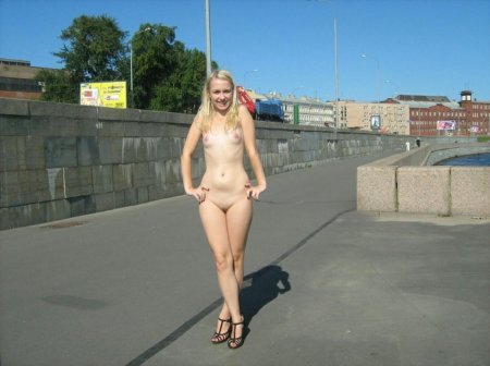 Naked blonde on the embankment
