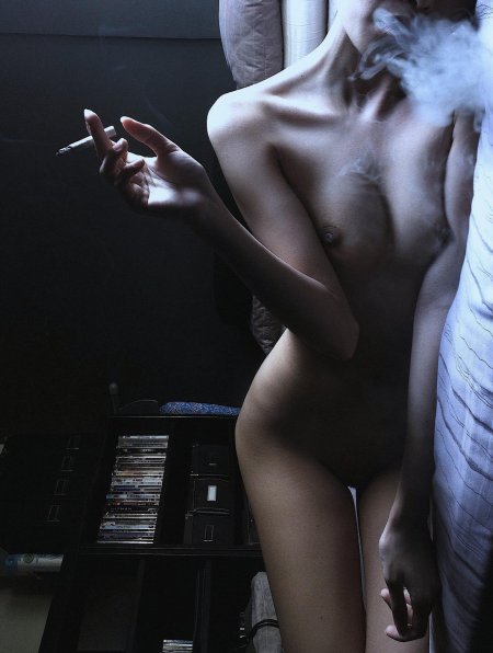 Girl Eroticly smokes