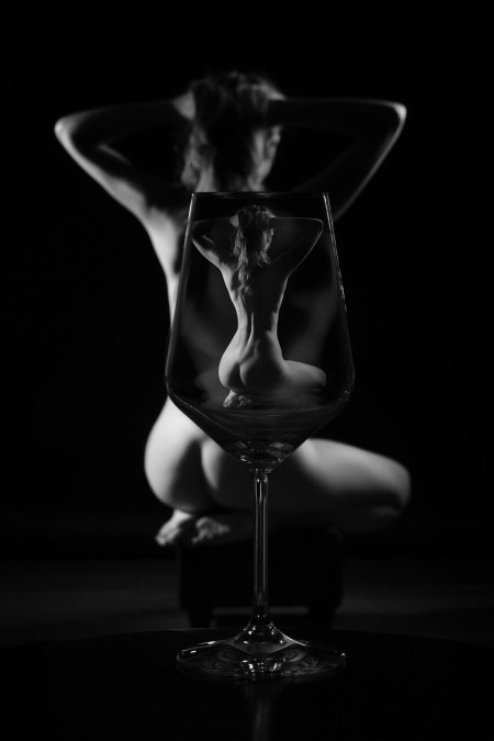 Erotic photo shoot with a glass