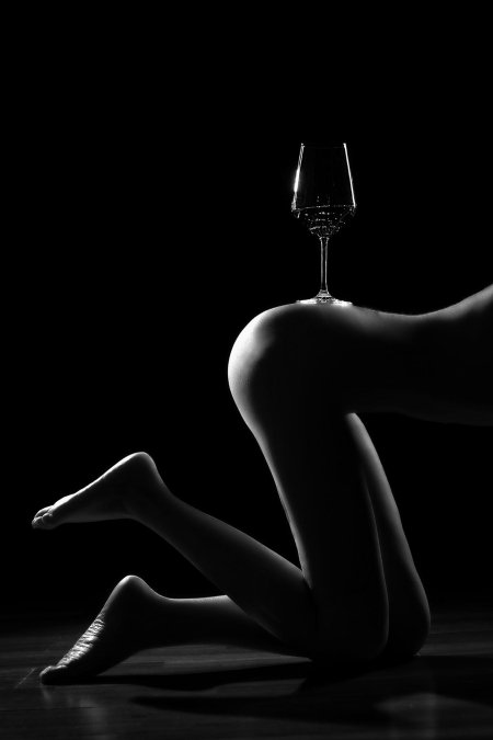 Erotic photo shoot with a glass