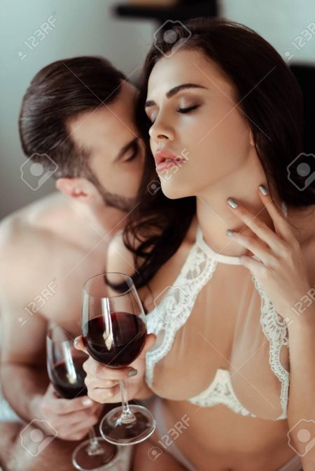A man and woman drink nude
