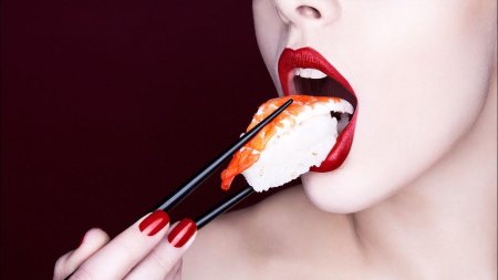 Girl eats sushi