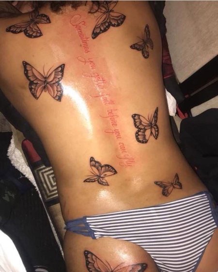 Tattoo butterfly on a glass