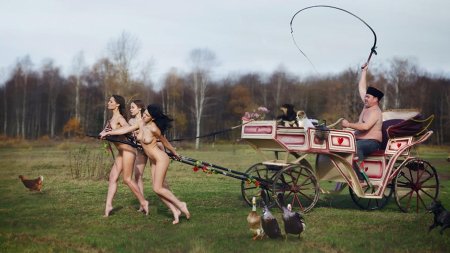 Naked women harnessed in carts