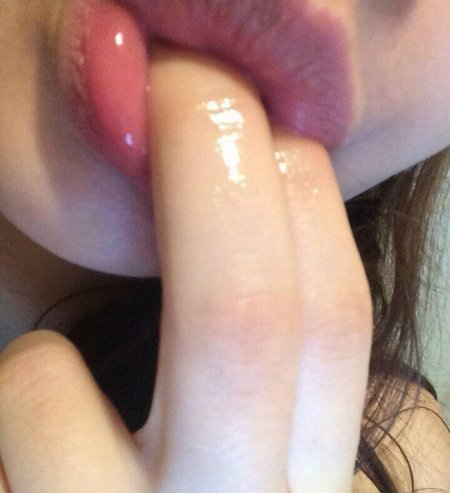 Two fingers in her mouth