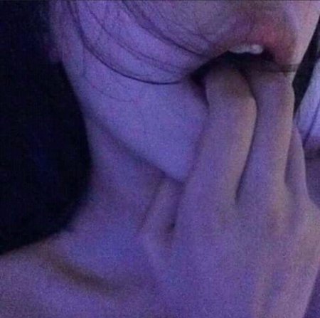 Finger in her mouth