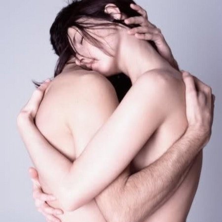 Naked man and woman hug