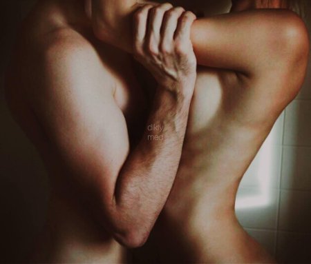 Naked man and woman hug