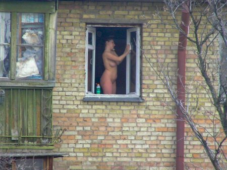 Naked in the windows of neighboring houses