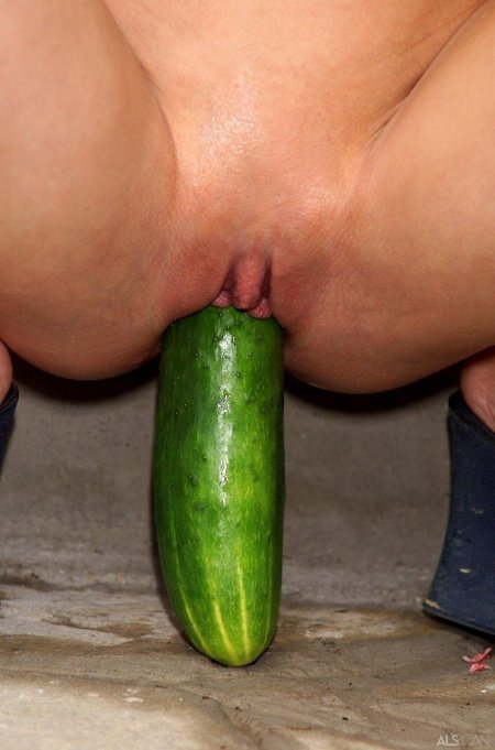 Girl with cucumber in vagina